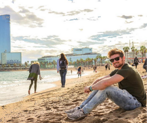 Barcelona student Jason on beach 300x250 Experience Barcelona with API