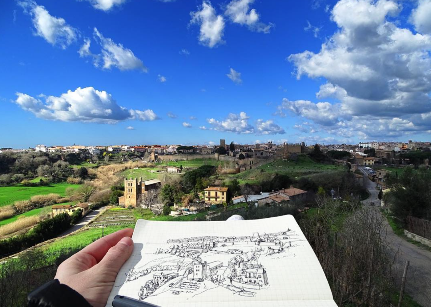 italy-tuscania-student-sketch-over-city