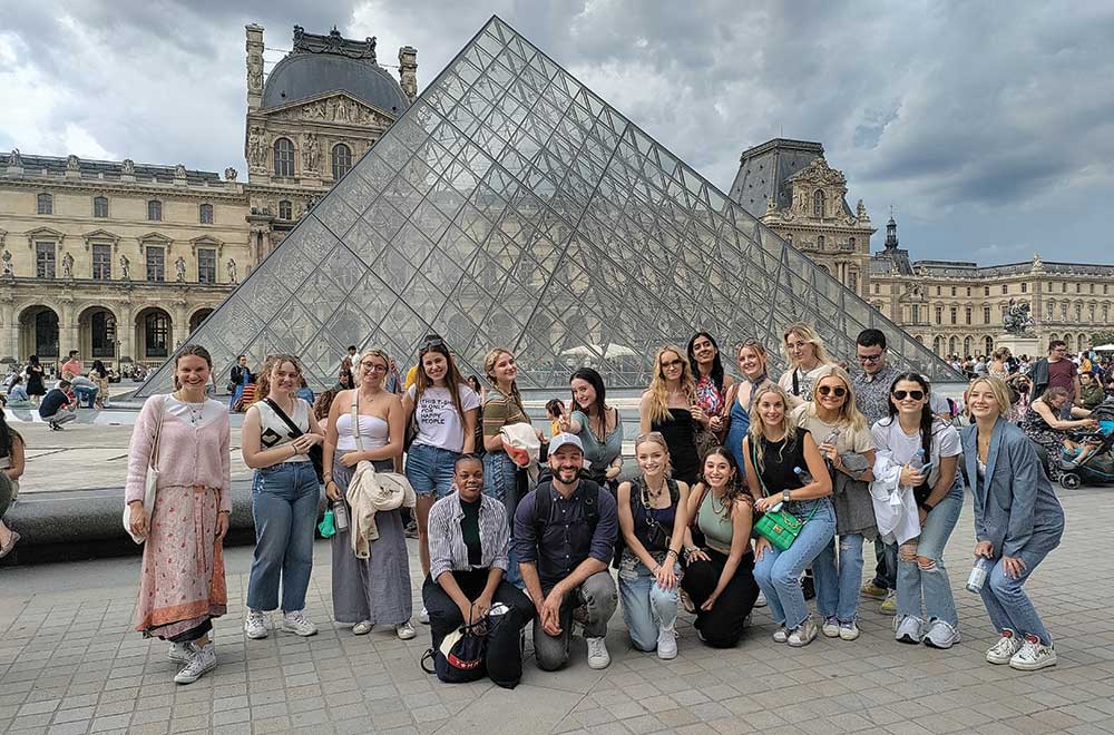 A group of students pose in Paris, France.