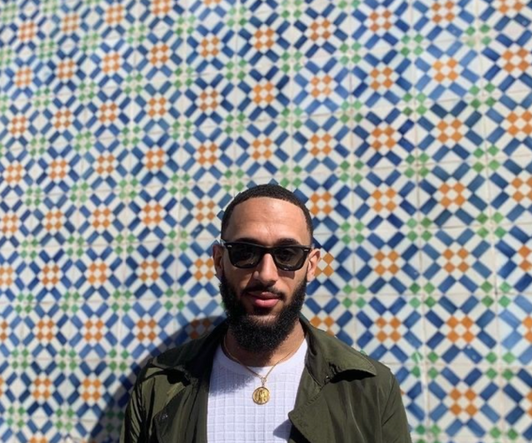 API Portugal student in front of decorative tiled wall