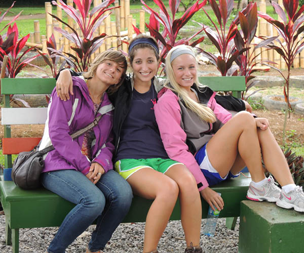 Three students pose in Costa Rica.